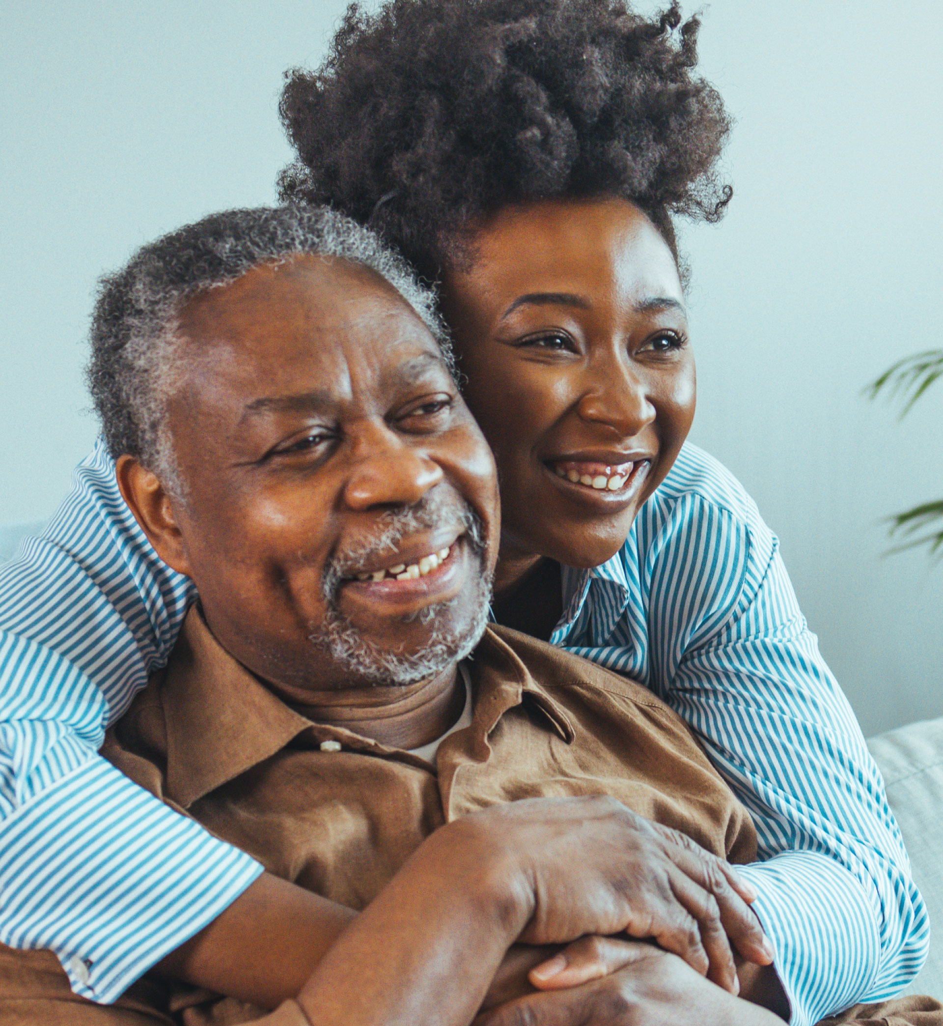 african american daughter hugging father